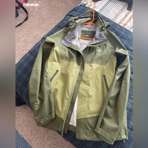 REI Elements Tain Jacket. Green. Vent zippers in the armpit. Water proof.